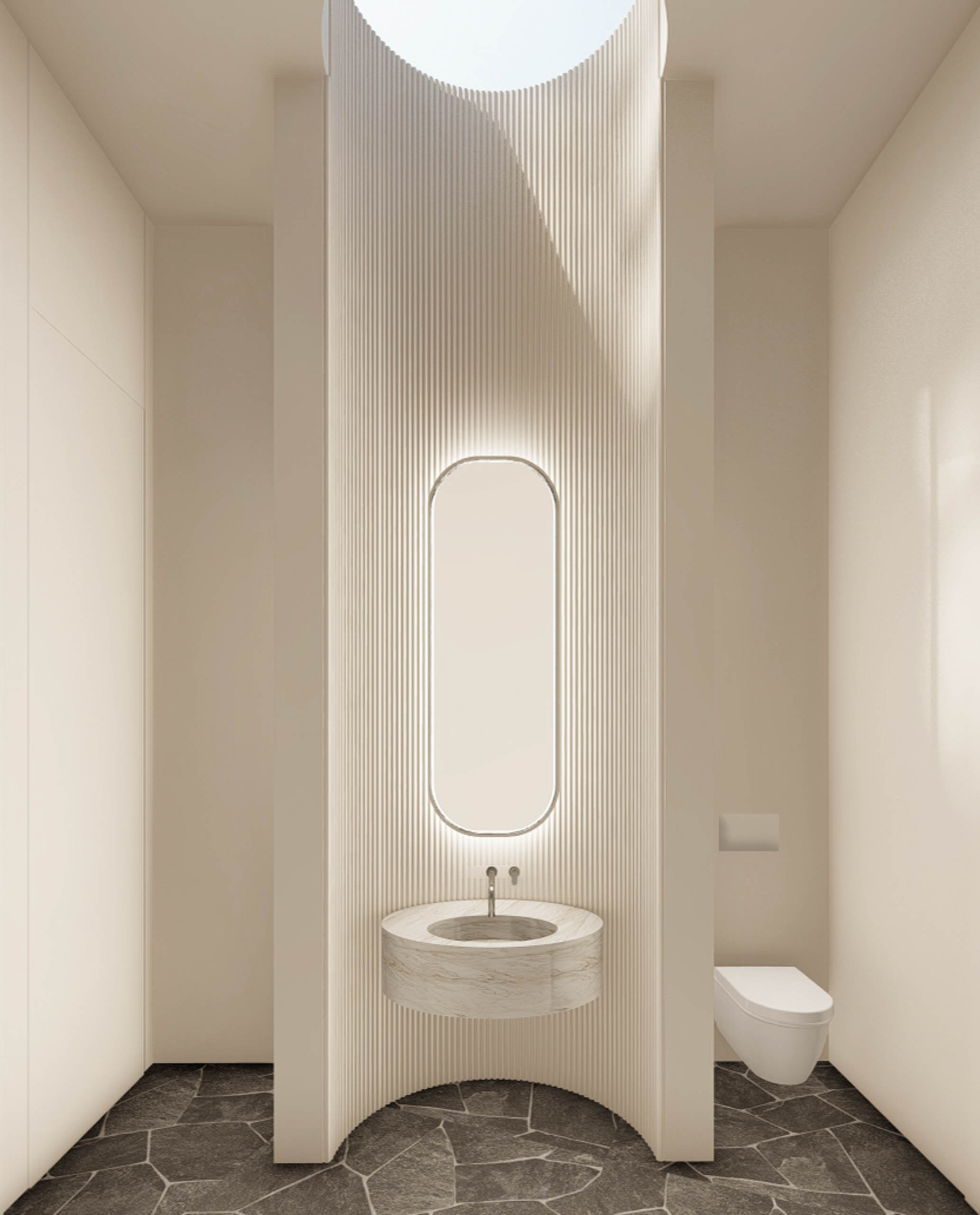 Tall white powder room with a curved cavity for the sink and tall oval mirror